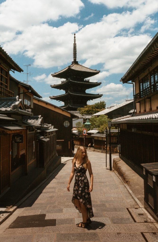 Woman standing in historic street in Kyoto, Japan (Sannezaka Ninezaka)
