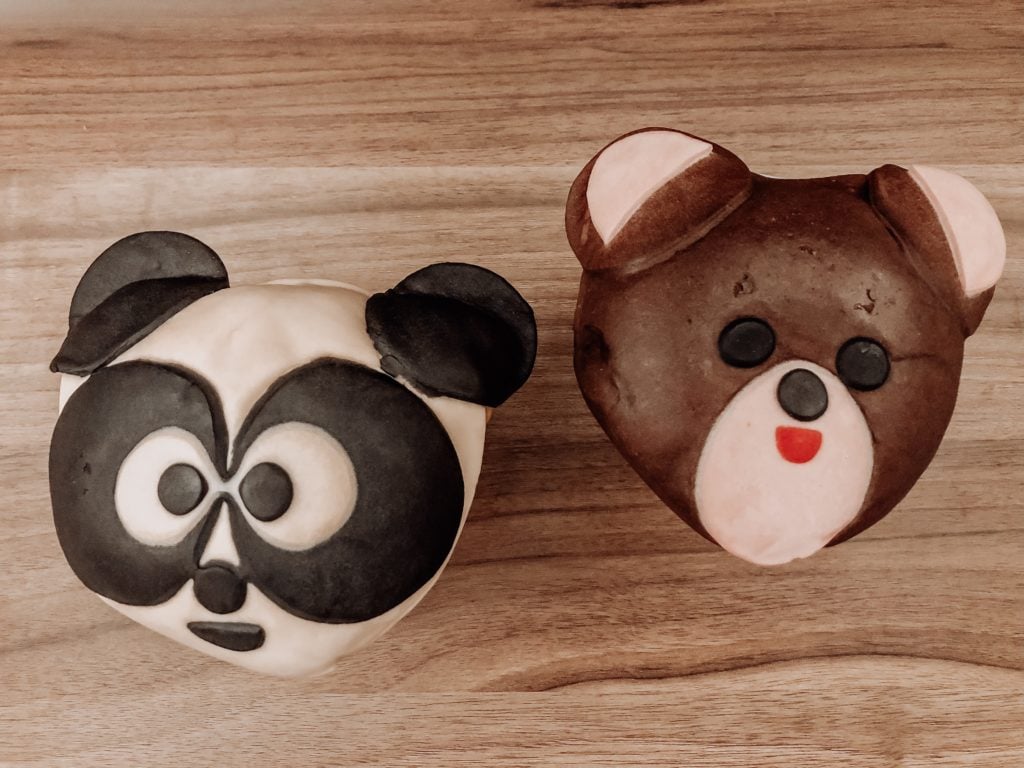 Two melon pan (first is shaped to look like a panda, second is shaped to look like a brown bear)