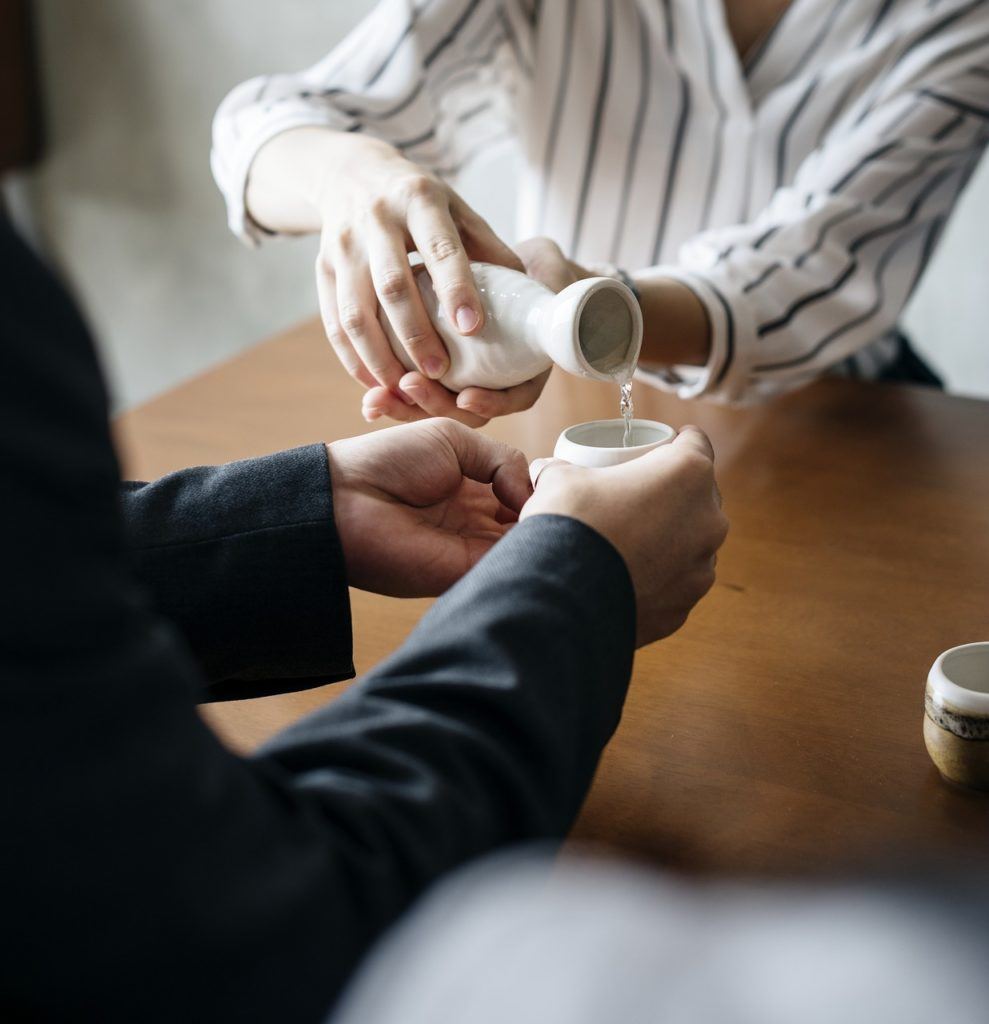 pouring a glass of sake