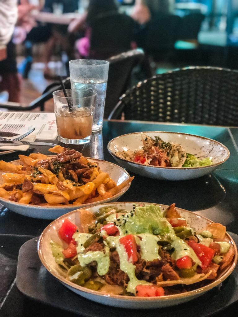 Happy hour menu items at Three's Bar & Grill in Maui.
