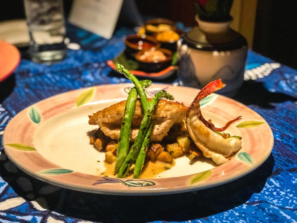 Mama’s Stuffed Fish with lobster and crab, baked a Macadamia nut crust at Mama's Fish House in Maui.